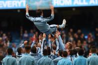 Manchester City's English midfielder Frank Lampard gets thrown in the air by his team-mates after the English Premier League football match between Manchester City and Southampton in Manchester, England on May 24, 2015