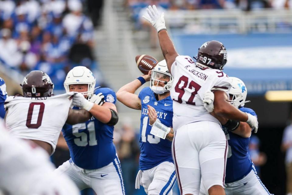 Kentucky quarterback Devin Leary (13) passes while under pressure against Eastern Kentucky during Saturday’s game at Kroger Field.