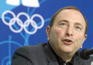 FILE - National Hockey League Commissioner Gary Bettman speaks to reporters during a press conference at the 2010 Winter Olympic Games in Vancouver, Feb. 18, 2010. NHL players are returning to the Olympics for the first time in more than a decade. The world's top hockey league will allow its players to participate in the Games in 2026 in Milan and in 2030 under an agreement announced Friday, Feb. 2, 2024, by the NHL, the NHL Players’ Association, International Ice Hockey Federation and the IOC. (Ryan Remiorz, The Canadian Press via AP, File)