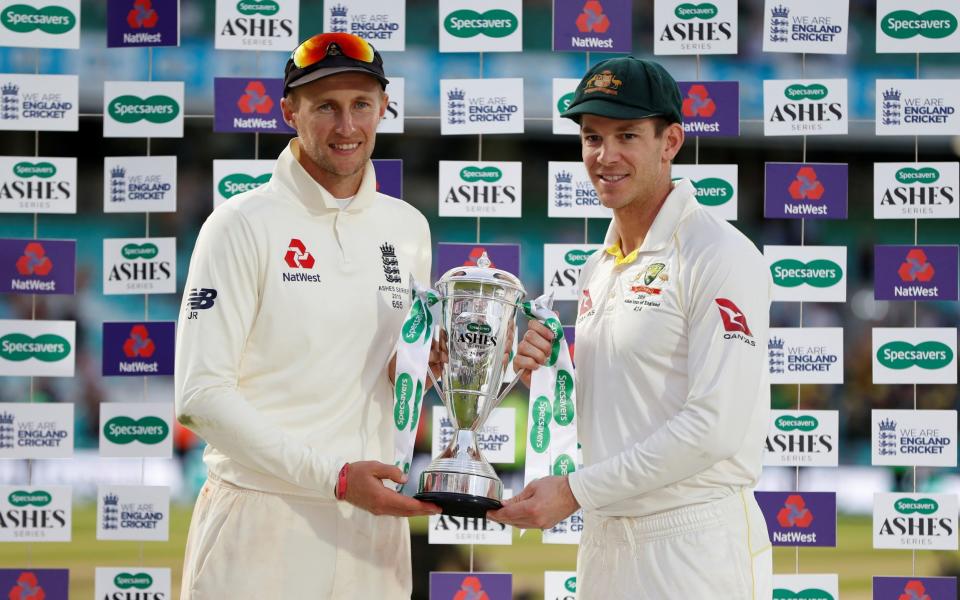 September 15, 2019 England's Joe Root and Australia's Tim Paine pose for a photo with the Ashes trophy after drawing the serie - Action Images via Reuters 