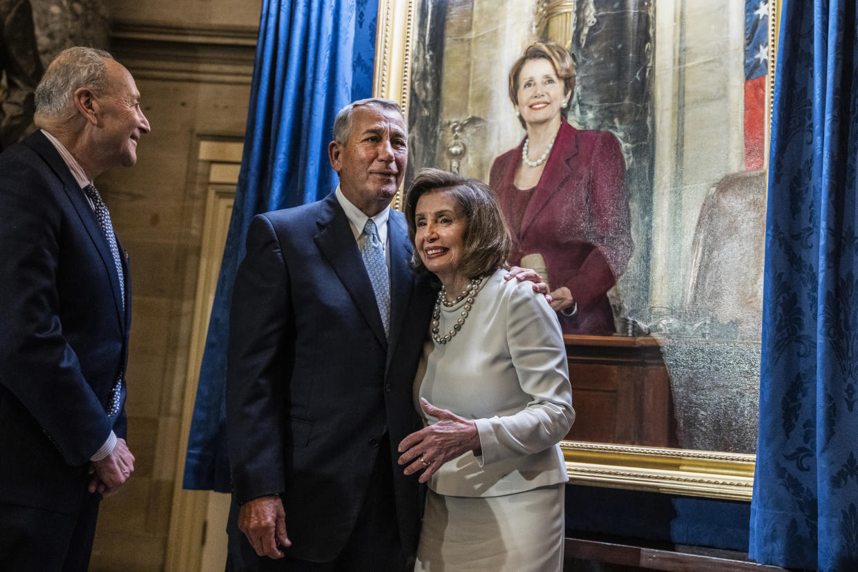 Speaker of the House Nancy Pelosi, D-Calif., greets former Speaker John Boehner, R-Ohio, during a portrait unveiling ceremony for Pelosi in the U.S. Capitols Statuary Hall on Dec. 14, 2022. (Tom Williams / CQ-Roll Call, Inc via Getty Images)