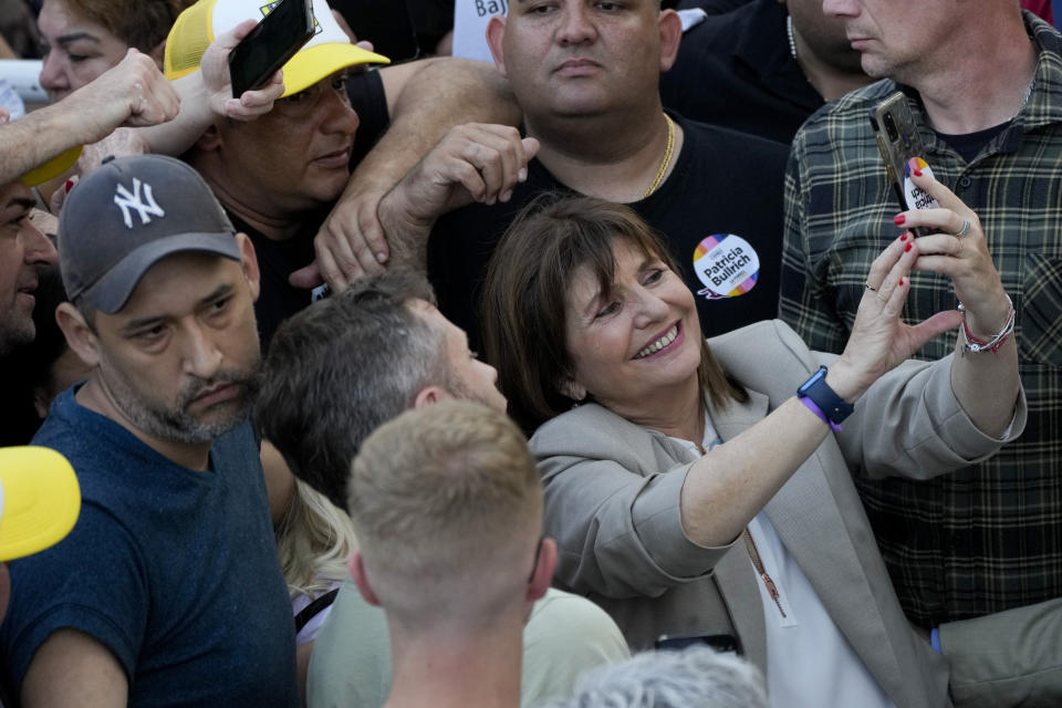 "Juntos por el Cambio" presidential candidate Patricia Bullrich has a selfie taken with her supporters during a campaign rally in Buenos Aires, Argentina Oct. 16, 2023. General elections are set for Oct. 22. (AP Photo/Natacha Pisarenko)