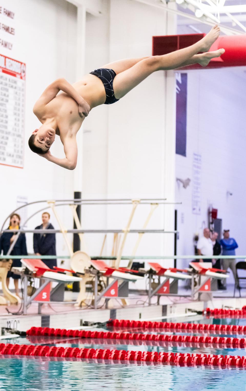 Whitefish Bay sophomore Tyler Emory performs a dive on his way to winning the event.