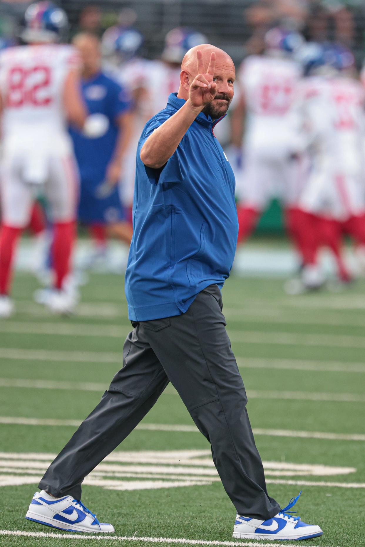 Aug 24, 2024; East Rutherford, New Jersey, USA; New York Giants head coach Brian Daboll walks across the field before the game against the New York Jets at MetLife Stadium. Mandatory Credit: Vincent Carchietta-USA TODAY Sports