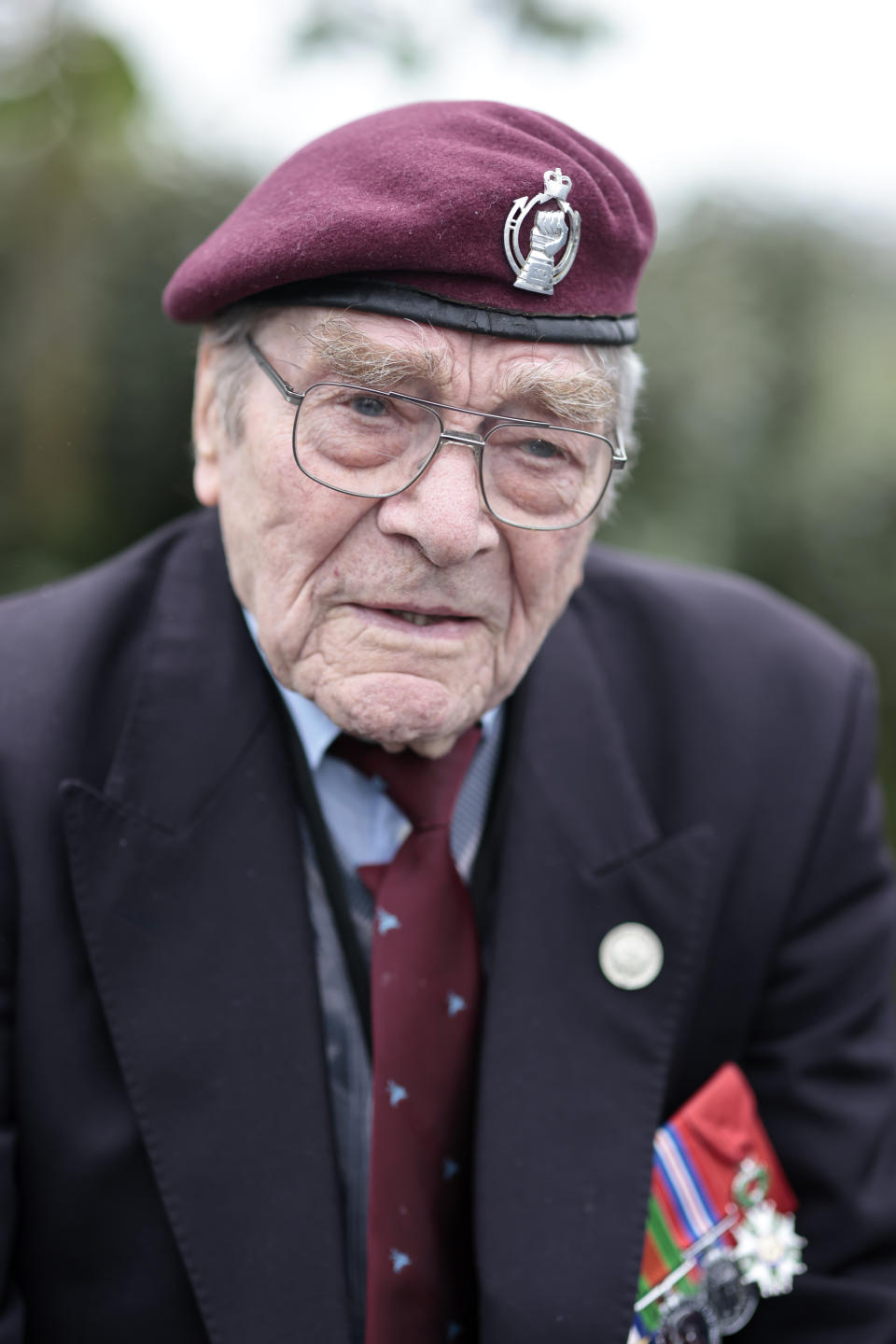 British veteran Bill Gladen arrives in a British Taxi Charity for Military Veterans to the ceremony at Pegasus Bridge, in Ranville, Normandy, Sunday, June, 5, 2022. On Monday, the Normandy American Cemetery and Memorial, home to the gravesites of 9,386 who died fighting on D-Day and in the operations that followed, will host U.S. veterans and thousands of visitors in its first major public ceremony since 2019. (AP Photo/Jeremias Gonzalez)