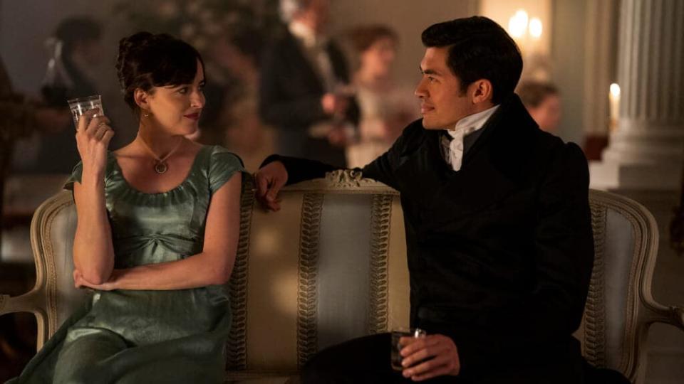 Persuasion. (L to R) Dakota Johnson as Anne Elliot, Henry Golding as Mr. Elliot in Persuasion. Cr. Nick Wall/Netflix © 2022