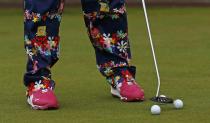 John Daly of the U.S. putts on the putting green during a practice round ahead of the British Open Championship at the Royal Liverpool Golf Club in Hoylake, northern England July 16, 2014. REUTERS/Stefan Wermuth (BRITAIN - Tags: SPORT GOLF TPX IMAGES OF THE DAY)