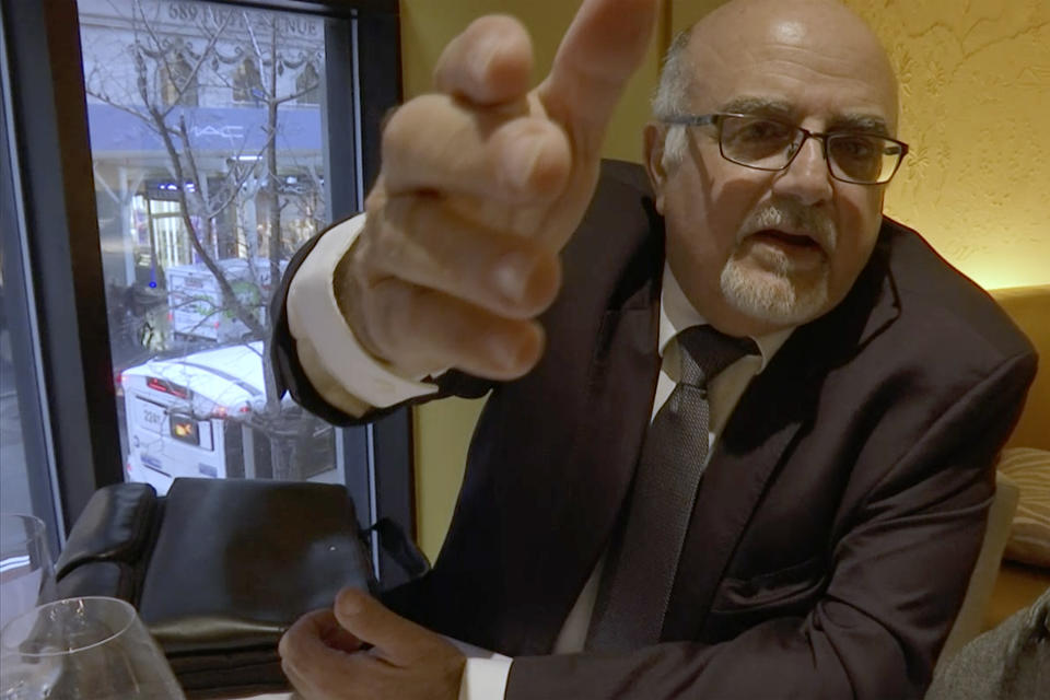 FILE - In this image from video, a man who identified himself as Michel Lambert, a director at the Paris-based agricultural technology firm CPW-Consulting, reacts during an interview at a restaurant in New York on Thursday, Jan. 24, 2019. Days after this video was broadcast, the Israeli investigative television show Uvda and The New York Times reported that Lambert was Aharon Almog-Assouline, a former Israeli security official living in the tony Tel Aviv suburb of Ramat Hasharon. (AP Photo/Joseph Frederick)