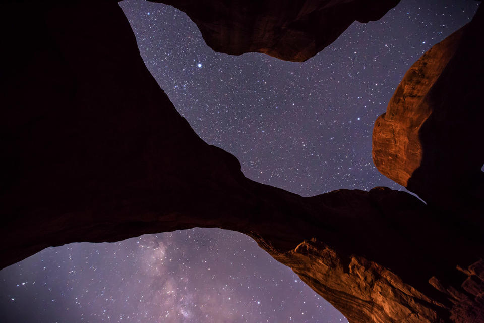 <p>Brad said: “My favorite photo shows me under the archway light to reveal its texture and detail, because it allows the viewer to appreciate how massive the structures are in relation to the smallness of a human being.” (Photo: Brad Goldpaint/Caters News) </p>