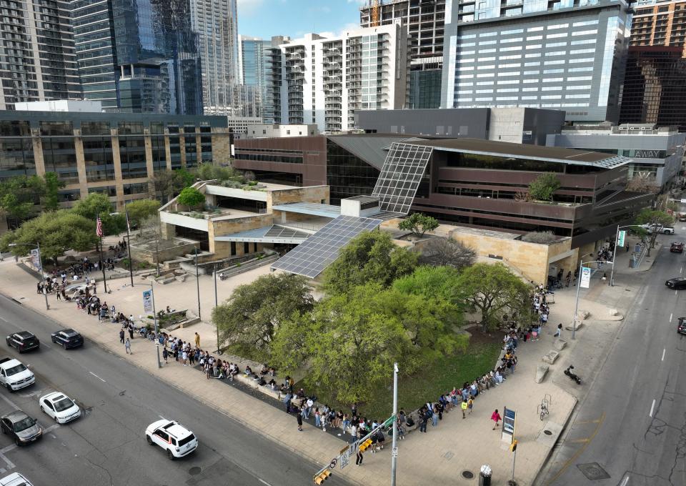 People wait in a line that wrapped around City Hall at 4:30 p.m. for a performance by Mexican singer Peso Pluma at ACL Live at Moody Theater during SXSW Wednesday March 13, 2024.