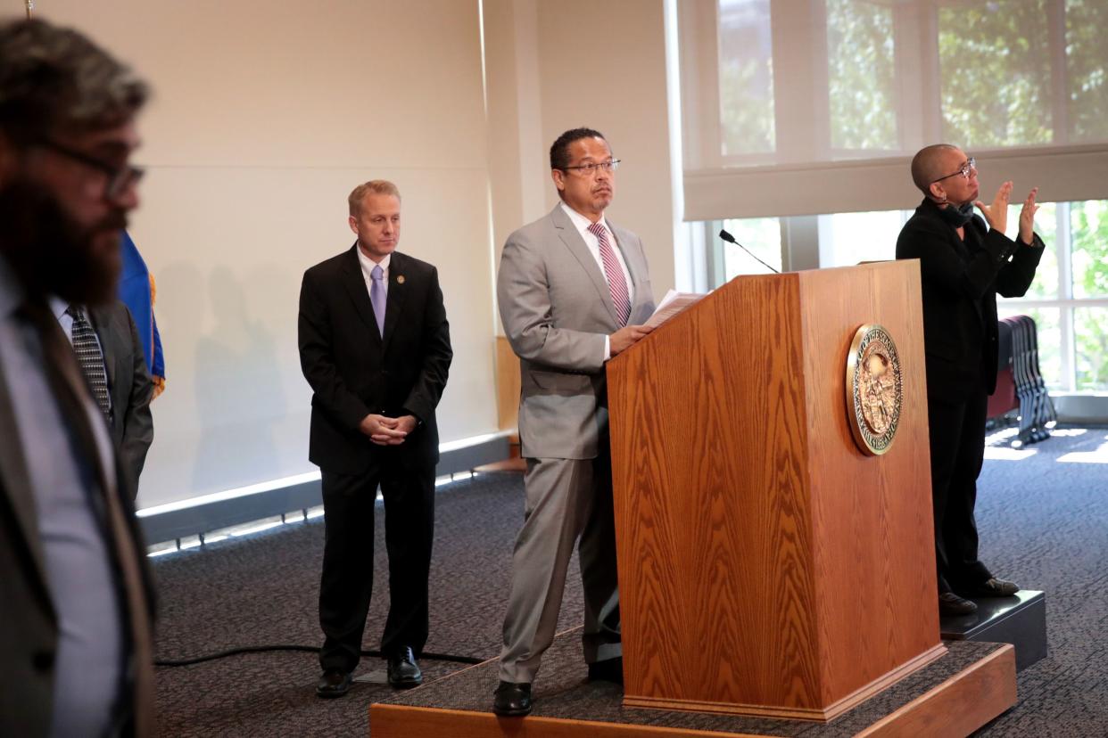 Minnesota Attorney General Keith Ellison (C) announces to the press that charges of aiding and abetting second-degree murder and aiding and abetting second-degree manslaughter had been filed against former Minneapolis police officers Thomas Lane, J. Alexander Kueng, and Tou Thao in the death of George Floyd on June 3, 2020 in St Paul, Minnesota. Ellison also announced that charges against former officer Derek Chauvin were upgraded to second-degree murder.