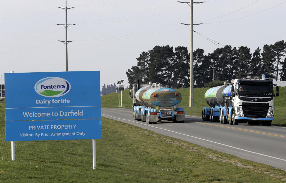 FILE - In this Sept. 12, 2018, file photo, Fonterra milk tankers pass each other outside the Darfield factory near Christchurch, New Zealand. New Zealand's largest company Fonterra once had grand ambitions to dominate the world's dairy markets, but after suffering stinging losses to the value of its businesses abroad has scaled back its vision. Fonterra on Thursday, Sept. 26, 2019, announced its worst-ever annual result as it wrote down the value of its assets by hundreds of millions of dollars and promised to stay more focused on its roots on New Zealand dairy farms. (AP Photo/Mark Baker, File)