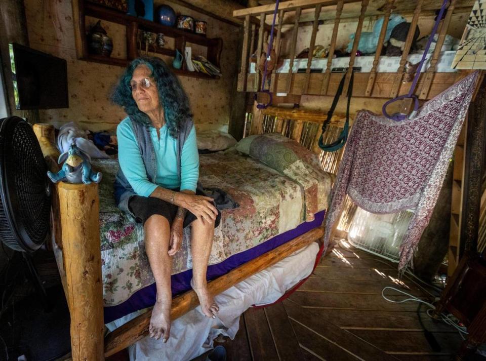 Shawnee Chasser in her bedroom on the ground floor right next to the treehouse on Friday, Sept. 8, 2023. This structure along with the treehouse are due to be torn down.