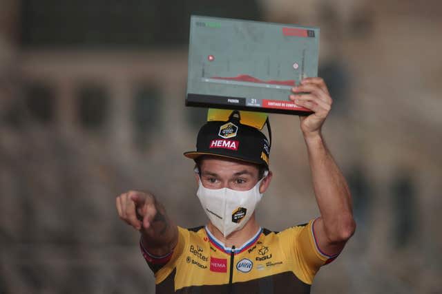 Primoz Roglic celebrates with the trophy after winning the 2021 Vuelta a Espana (Luis Vieira/AP)