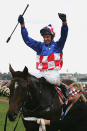 <p>Glen Boss celebrates on Makybe Diva as he returns to scale after winning the Melbourne Cup for the third year in a row during The Melbourne Cup Carnival at Flemington Racecourse</p>