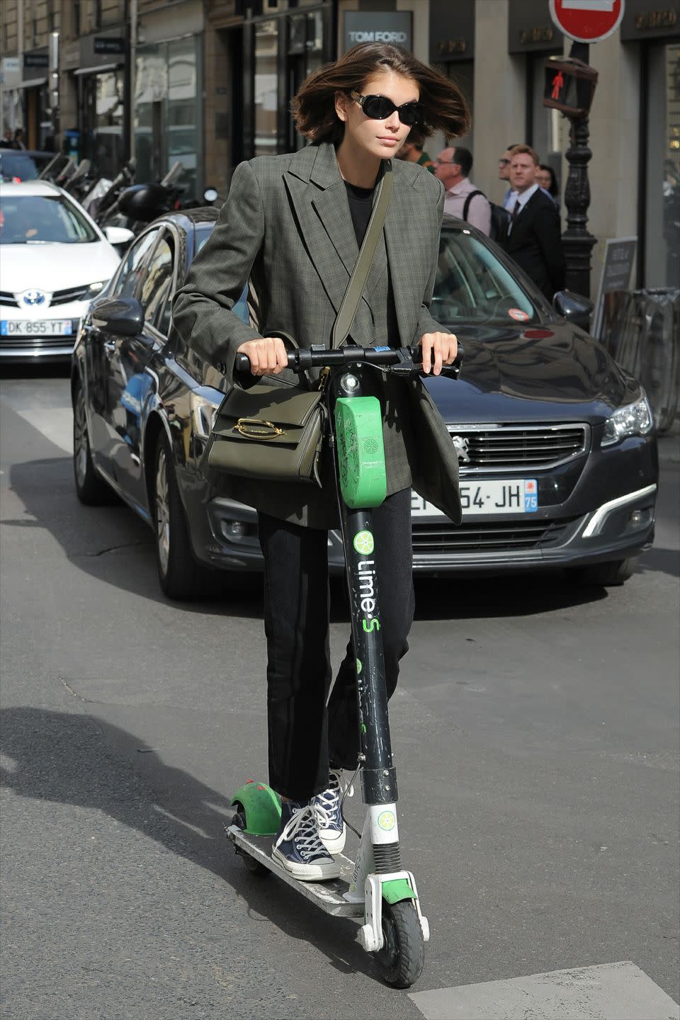 <p>The model was spotted darting about in Paris on a scooter, wearing a paired down look with the new Alexander McQueen<a href="https://www.elle.com/uk/fashion/g21202204/designer-bags-we-want-to-splash-our-cash-on/?slide=2" rel="nofollow noopener" target="_blank" data-ylk="slk:Story bag;elm:context_link;itc:0;sec:content-canvas" class="link "> Story bag</a>. </p>