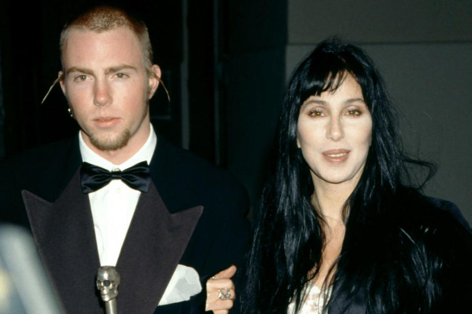 <p>Ron Davis/Getty</p> Cher and her son Elijah Blue Allman attend the 5th Annual Fire and Ice Ball to Benefit Revlon UCLA Women Cancer Center on December 7, 1994 at the 20th Century Fox Studios in Century City, California.  