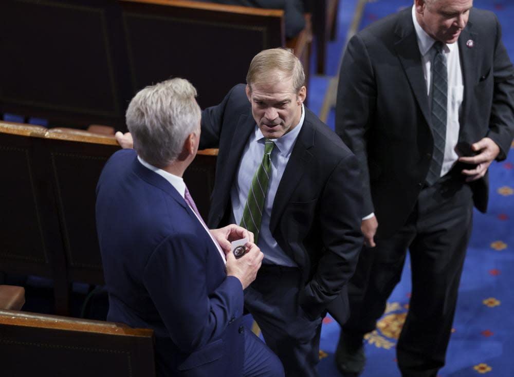 Rep. Jim Jordan, R-Ohio, center, speaks with House Minority Leader Kevin McCarthy, R-Calif., left, in the House chamber during the vote to create a select committee to investigate the Jan. 6 insurrection, at the Capitol in Washington, Wednesday, June 30, 2021. (AP Photo/J. Scott Applewhite)
