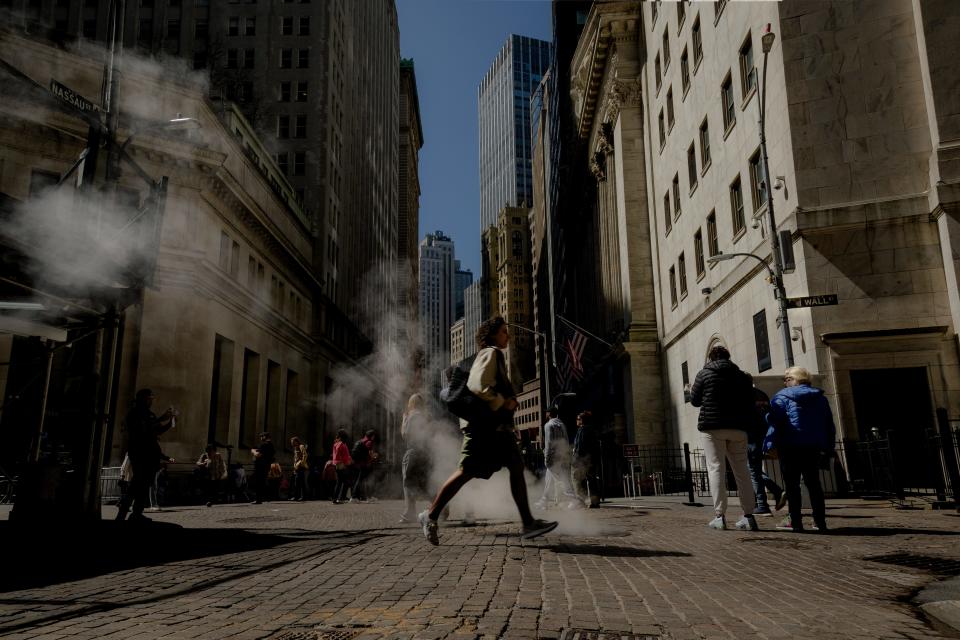 A woman walks in Manhattan's Financial District