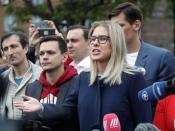 Russian opposition candidate and lawyer at the Foundation for Fighting Corruption Lyubov Sobol speaks to a crowd during a protest in Moscow, Russia, Sunday, July 14, 2019. Opposition candidates who run for seats in the city legislature in September's elections have complained that authorities try to bar them from the race by questioning the validity of signatures of city residents they must collect in order to qualify for the race. (AP Photo/Pavel Golovkin)