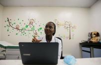 Dr. Marieta Ekeng, a pediatrician at EHA clinics, speaks during an interview with Reuters in her office after teleconsultation with a patient Loveth Metiboba in Abuja