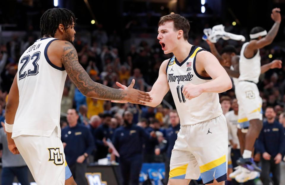 Marquette Golden Eagles forward David Joplin (23) and Marquette Golden Eagles guard Tyler Kolek (11) celebrate after NCAA Menâ€™s Basketball Tournament game against the Colorado Buffaloes, Sunday, March 24, 2024, at Gainbridge Fieldhouse in Indianapolis.