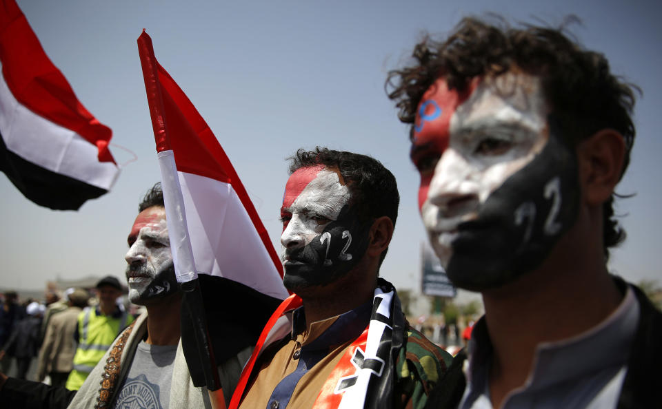 <p>Men with Yemen’s flag painted on their faces, attend a ceremony to commemorate the 26th anniversary of Yemen’s reunification, in Sanaa, Yemen, May 22, 2016. South and North Yemen were independent states until unification in 1990. (Hani Mohammed/AP) </p>