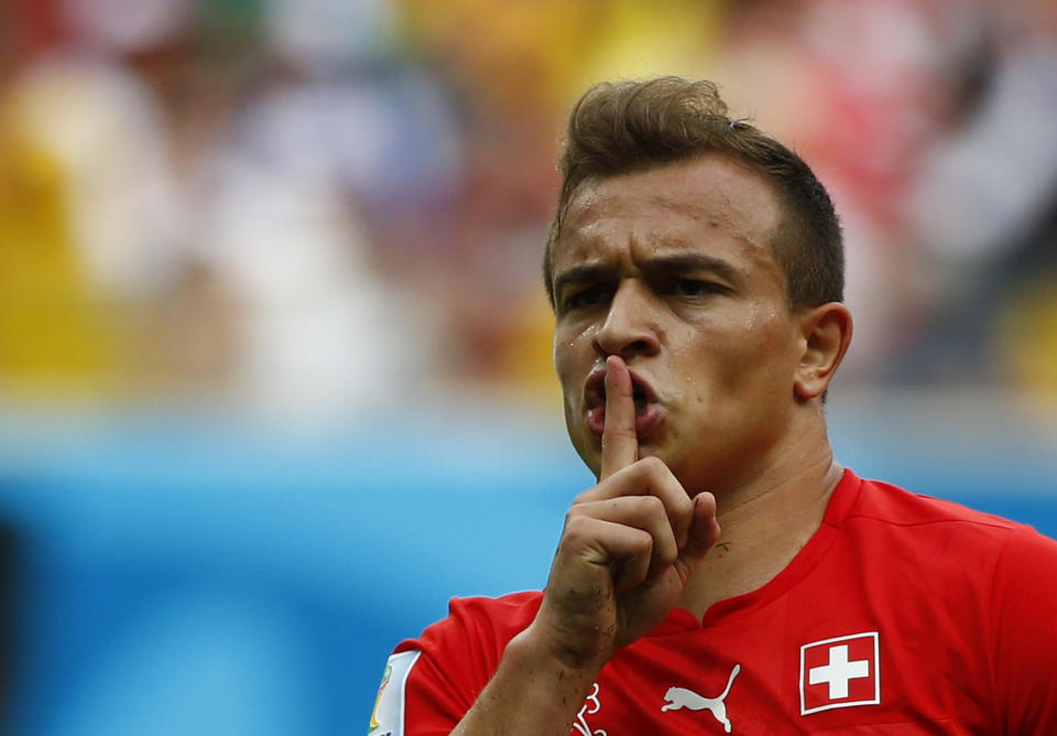 Switzerland's Xherdan Shaqiri celebrates after scoring a goal during the 2014 World Cup Group E soccer match between Honduras and Switzerland at the Amazonia arena in Manaus June 25, 2014. REUTERS/Michael Dalder (BRAZIL - Tags: TPX IMAGES OF THE DAY SOCCER SPORT WORLD CUP)