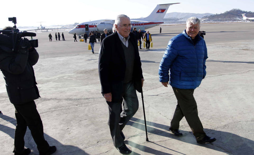 Pacific Century Institute Chairman Donald Gregg, center, and his party arrive at Pyongyang Airport in Pyongyang, North Korea, Monday, Feb. 10, 2014. Gregg, a former U.S. ambassador to South Korea, arrived in Pyongyang on Monday with representatives of the Pacific Century Institute, a private U.S. group. Gregg wouldn't say what he hoped to discuss there. (AP Photo/Jon Chol Jin)