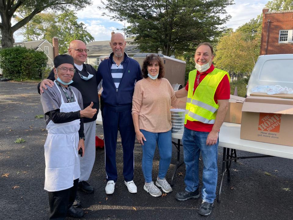 Karen DeMarco, founder and president of The Food Brigade of Bergen County, with husband Carmine DeMarco at right and representatives of Picco Tavern in Hackensack