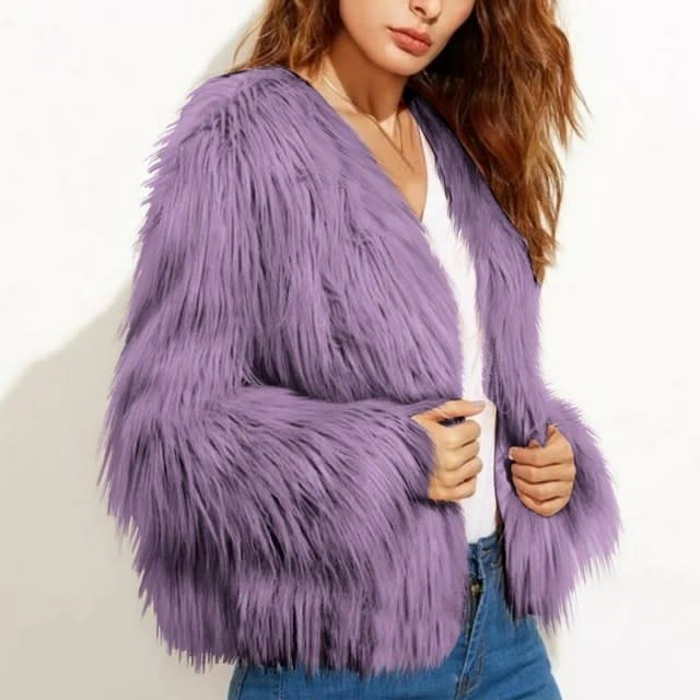 model wearing purple fur coat