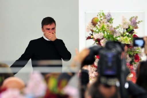 Belgian designer Raf Simons cries at the end of the Jil Sander Fall-winter 2012-2013 collection in February 2012. French fashion powerhouse Dior on Monday named Simons as chief designer to succeed disgraced John Galliano who was fired more than a year ago for racist outbursts