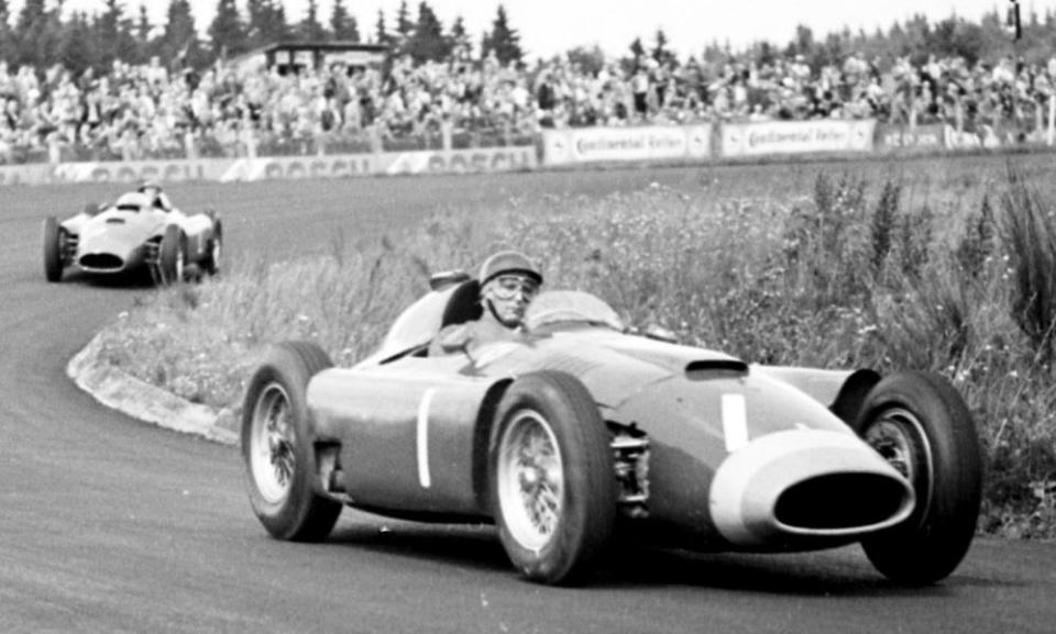 Ferrari’s Juan Manuel Fangio leads Peter Collins in the 1956 German Grand Prix at Nürburgring. The Argentinian won the race while Collins retired. 