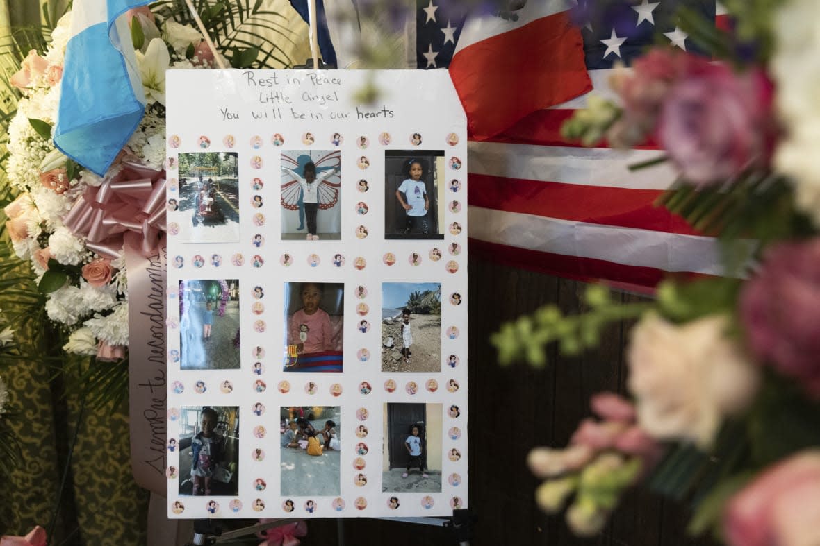 Photos of Anadith Danay Reyes Alvarez are displayed during the wake at R.G. Ortiz Funeral Home on Friday, June 16, 2023, in New York. (AP Photo/Jeenah Moon)