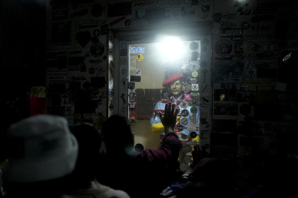 People visit Argentina's folk Saint "Gauchito" Gil sanctuary in Mercedes, Corrientes, Argentina, Sunday, Jan. 7, 2024. Every Jan. 8, devotees from across the country visit his sanctuary to ask for miracles or give him thanks.(AP Photo/Natacha Pisarenko)