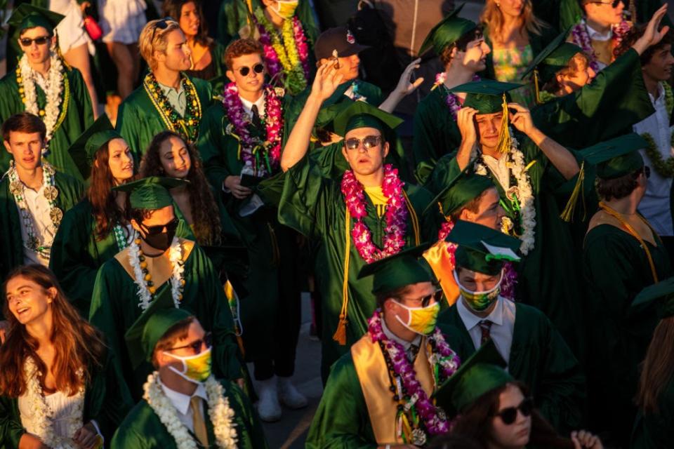 June 11: Graduates from Mira Costa High School in Manhattan Beach, California, gather at the Manhattan Beach Pier following their drive-through commencement ceremony. (Getty Images)