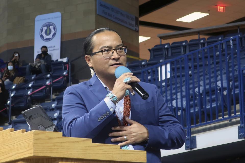 FILE - Navajo Nation President Buu Nygren addresses a crowd at an indoor sports arena, Tuesday, Jan. 10, 2023, in Fort Defiance, Ariz. Navajo President Buu Nygren vowed to carry out a plan to enact roadblocks to prevent the transportation of uranium ore through the reservation while the tribe develops regulations to cover what are the first major shipments of uranium through its land in years. (AP Photo/Felicia Fonseca, File)