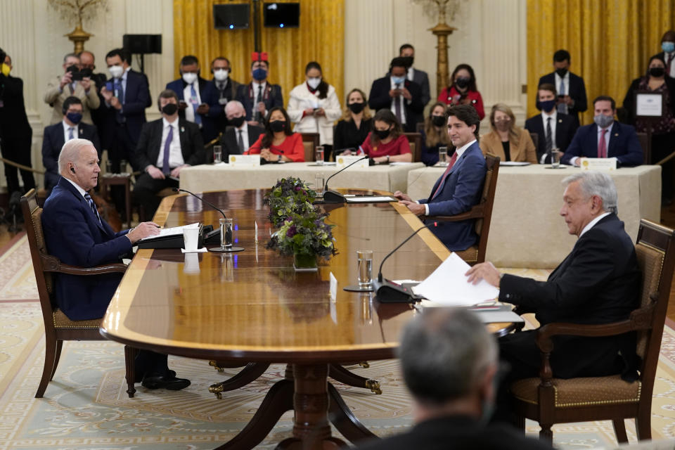 President Joe Biden, left, sits down for a meeting with Canadian Prime Minister Justin Trudeau, center, and Mexican President Andrés Manuel López Obrador, right, in the East Room of the White House in Washington, Thursday, Nov. 18, 2021. (AP Photo/Susan Walsh)