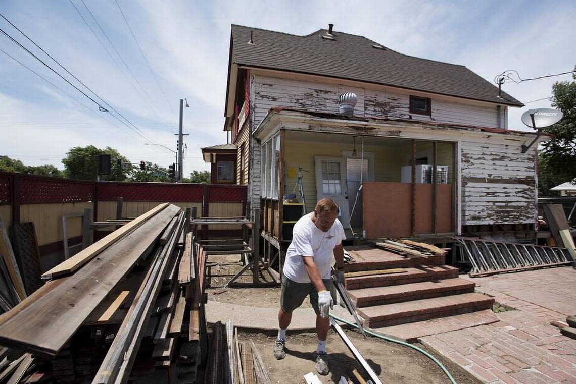 Homeowner James Dietrich works in the backyard of his recently painted Queen Anne style victorian on the corner of West Orangeburg and Tully Road in Modesto Andy Alfaro/aalfaro@modbee.com