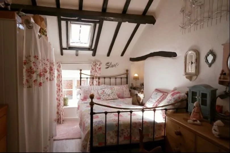 The cosy main bedroom, with traditional wooden beams