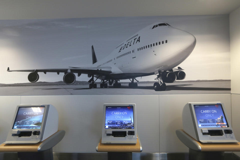 Self service check in kiosks sit in the new Delta airlines terminal 4 at JFK airport, Friday, May 24, 2013 in New York. Delta Air Lines is opening a $1.4 billion terminal at John F. Kennedy International Airport, strengthening its hand in the battle for the lucrative New York travel market. (AP Photo/Mary Altaffer)