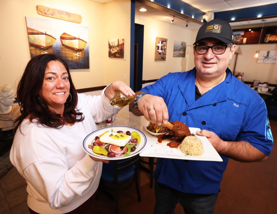 Mediterranean Bar & Grill owners Nicholas A. Dimakis and his wife Maria Dimakis show off some of the Taunton restaurant's authentic Greek dishes on Thursday, April 25, 2024.