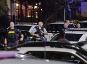 Police secure the area after reports that a gunman fired shots at the Garden State Plaza mall in Paramus, New Jersey, November 4, 2013. A person with a gun opened fire on Monday evening in the New Jersey shopping mall shortly before closing time in the town of Paramus, and the mall was being evacuated, a county official said. (REUTERS/Ray Stubblebine)