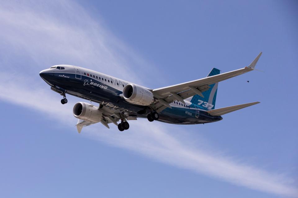 FILE PHOTO: A Boeing 737 MAX airplane lands after a test flight at Boeing Field in Seattle, Washington, U.S. June 29, 2020. REUTERS/Karen Ducey