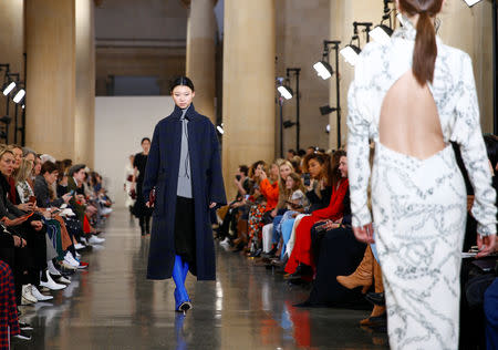 Models present creations at the Victoria Beckham show during London Fashion Week Women's A/W19 in London, Britain February 17, 2019. REUTERS/Henry Nicholls