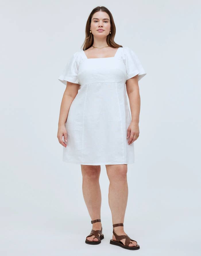 Model wearing the eyelet white dress