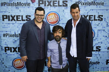 (L-R) Actors Josh Gad, Peter Dinklage, and Adam Sandler attend the premiere of the movie "Pixels" in New York July 18, 2015. REUTERS/Eduardo Munoz