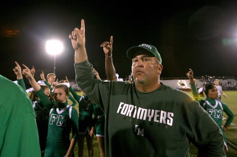 Fort Myers High School head football coach Sam Sirianni Jr. celebrates after winning the school's 600th win in 2010.