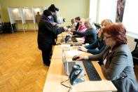 People cast their votes during Estonia's general election in Parnu