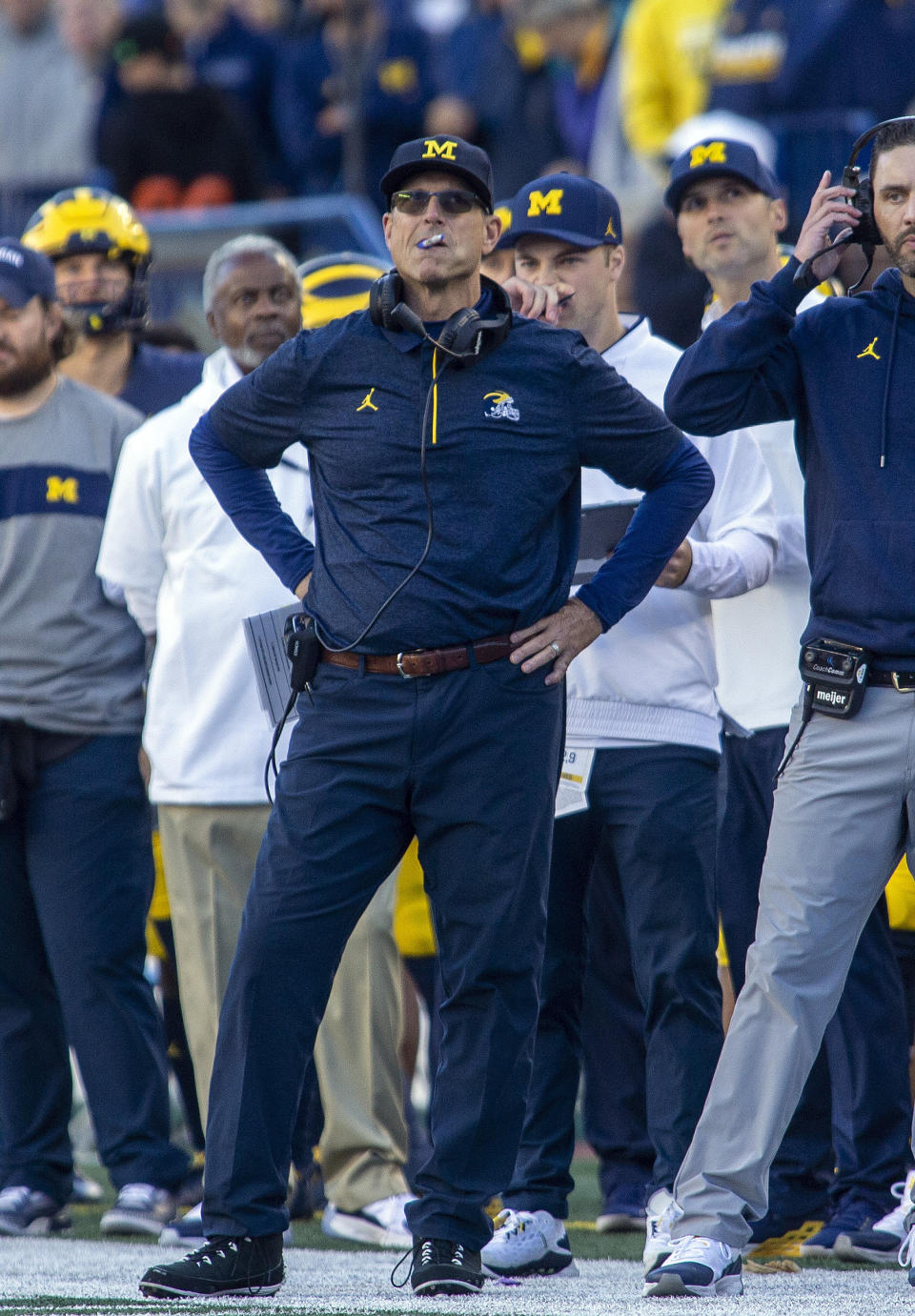 Michigan head coach Jim Harbaugh looks at the scoreboard from the sideline in the fourth quarter of an NCAA college football game against Rutgers in Ann Arbor, Mich., Saturday, Sept. 25, 2021. Michigan won 20-13. (AP Photo/Tony Ding)